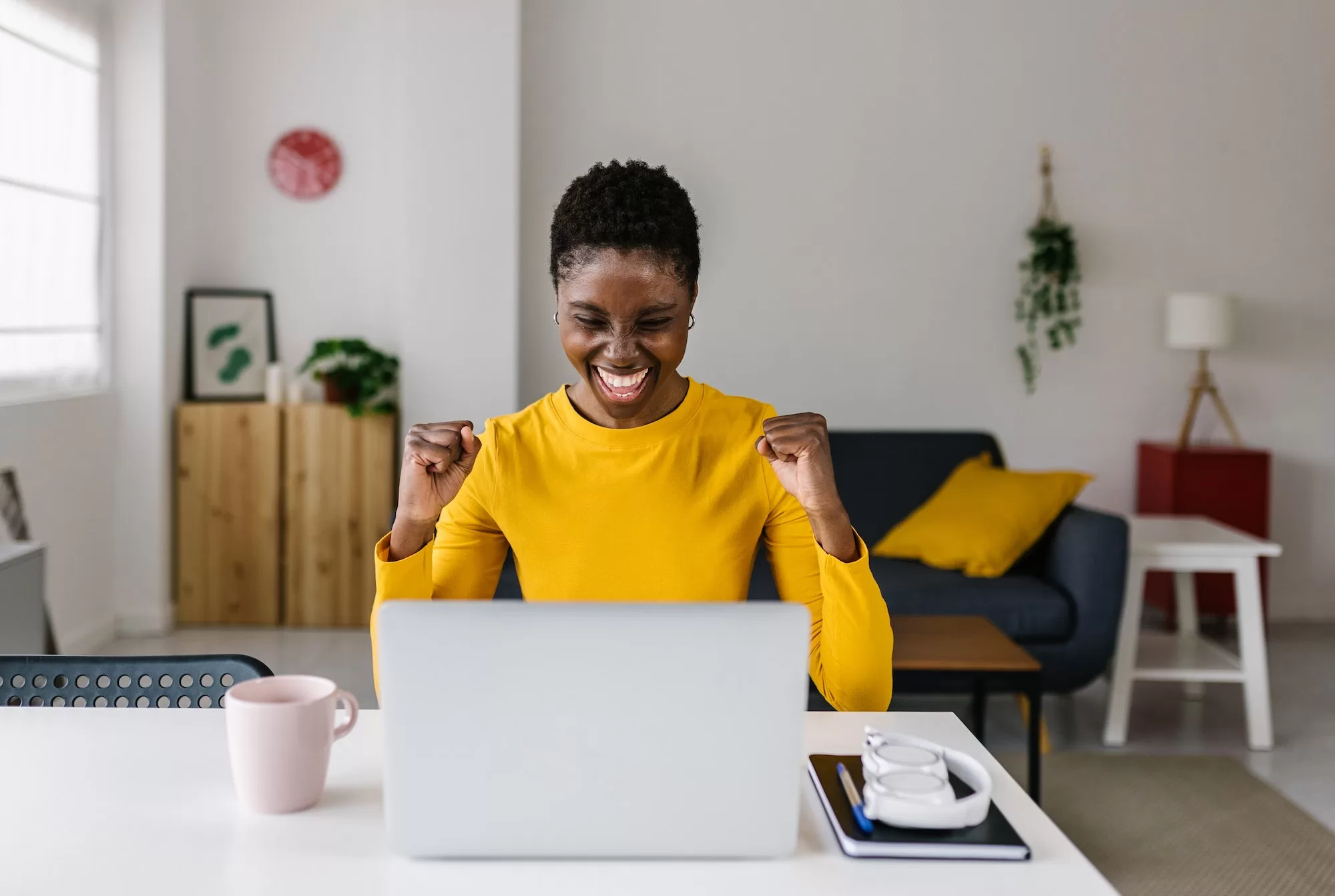 How to Get Any Job You Want on NIEIS (Namibia Integrated Employment Information System) | Excited young african woman celebrating success while working on laptop at home. NIEIS Namibia