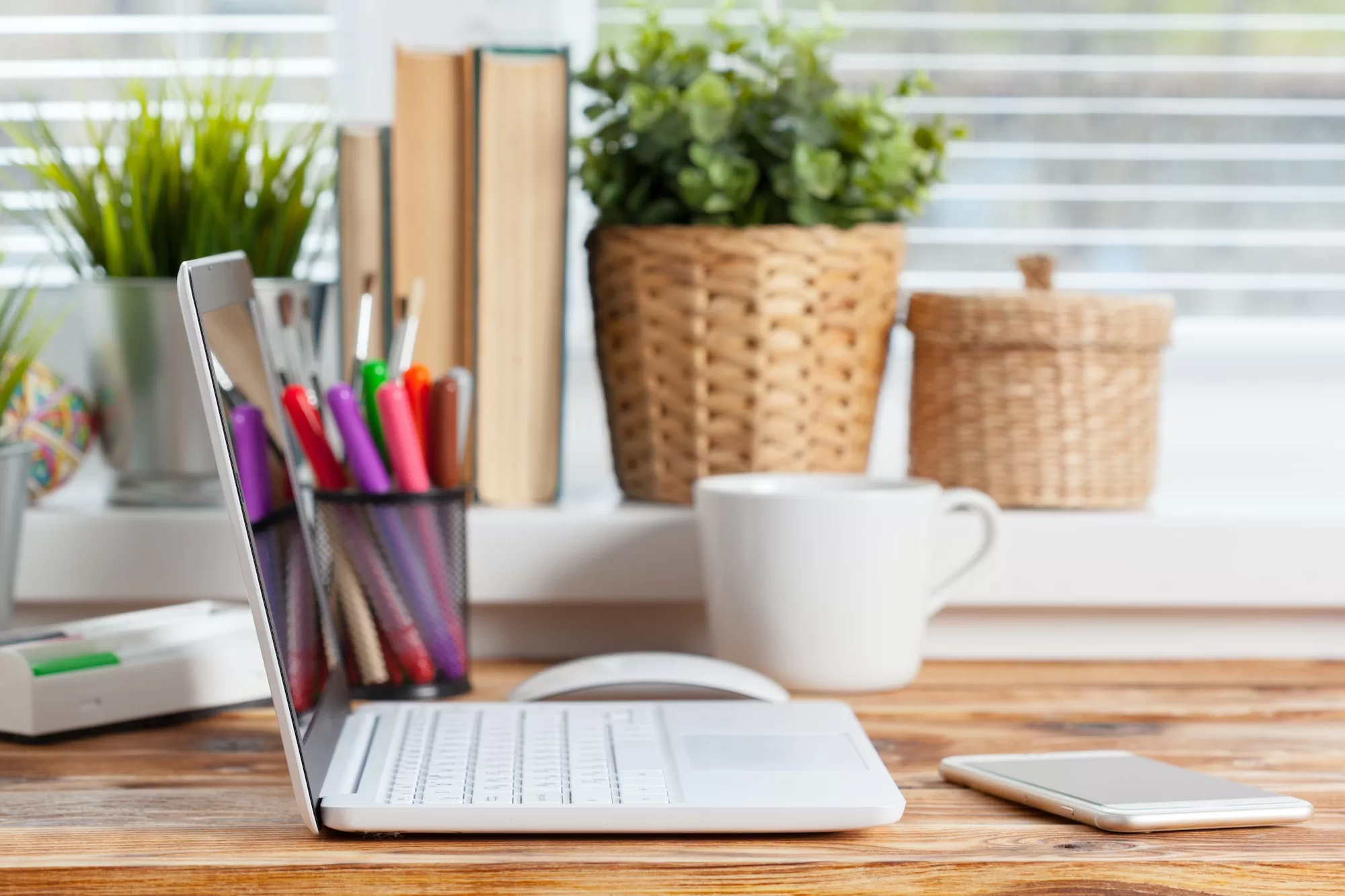 Work space. laptop blank screen on wooden table. | How to get your first job on Upwork