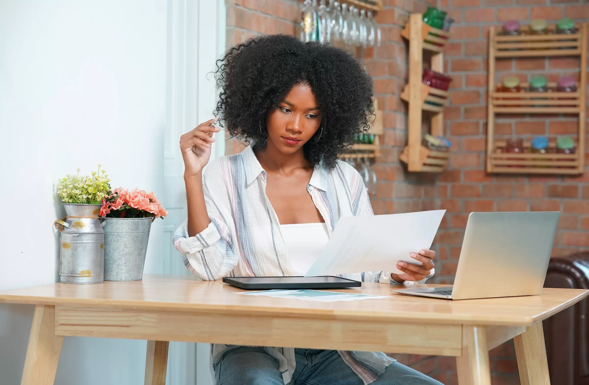 Young serious accountant is calculating profit and doing paperwork. Finances and investment. Development Bank of Namibia financial assistance