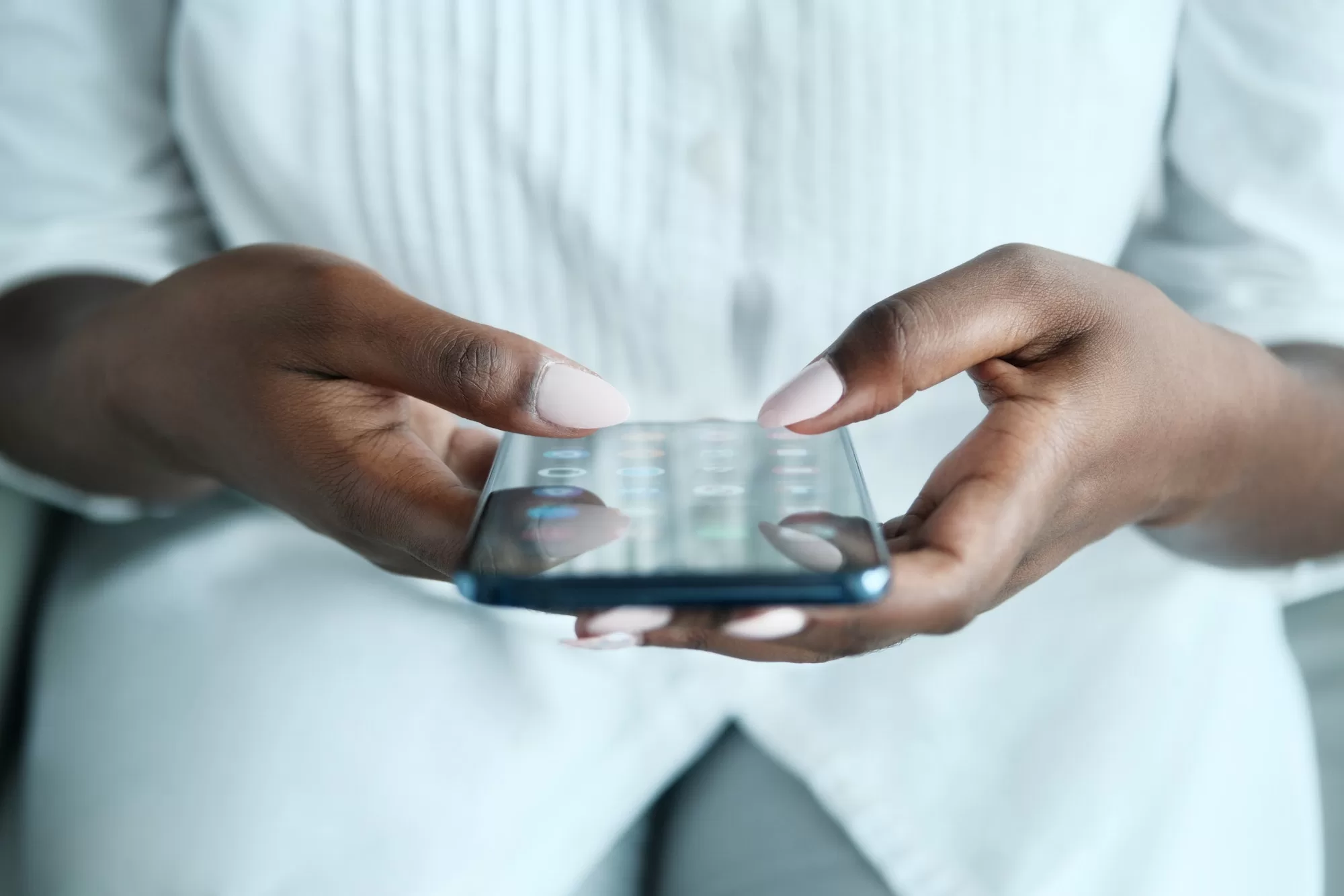 Black Woman Looking For Application On Smartphone | Application Process and Mandatory Documents To Become an Enumerator for the Namibian Census 2023