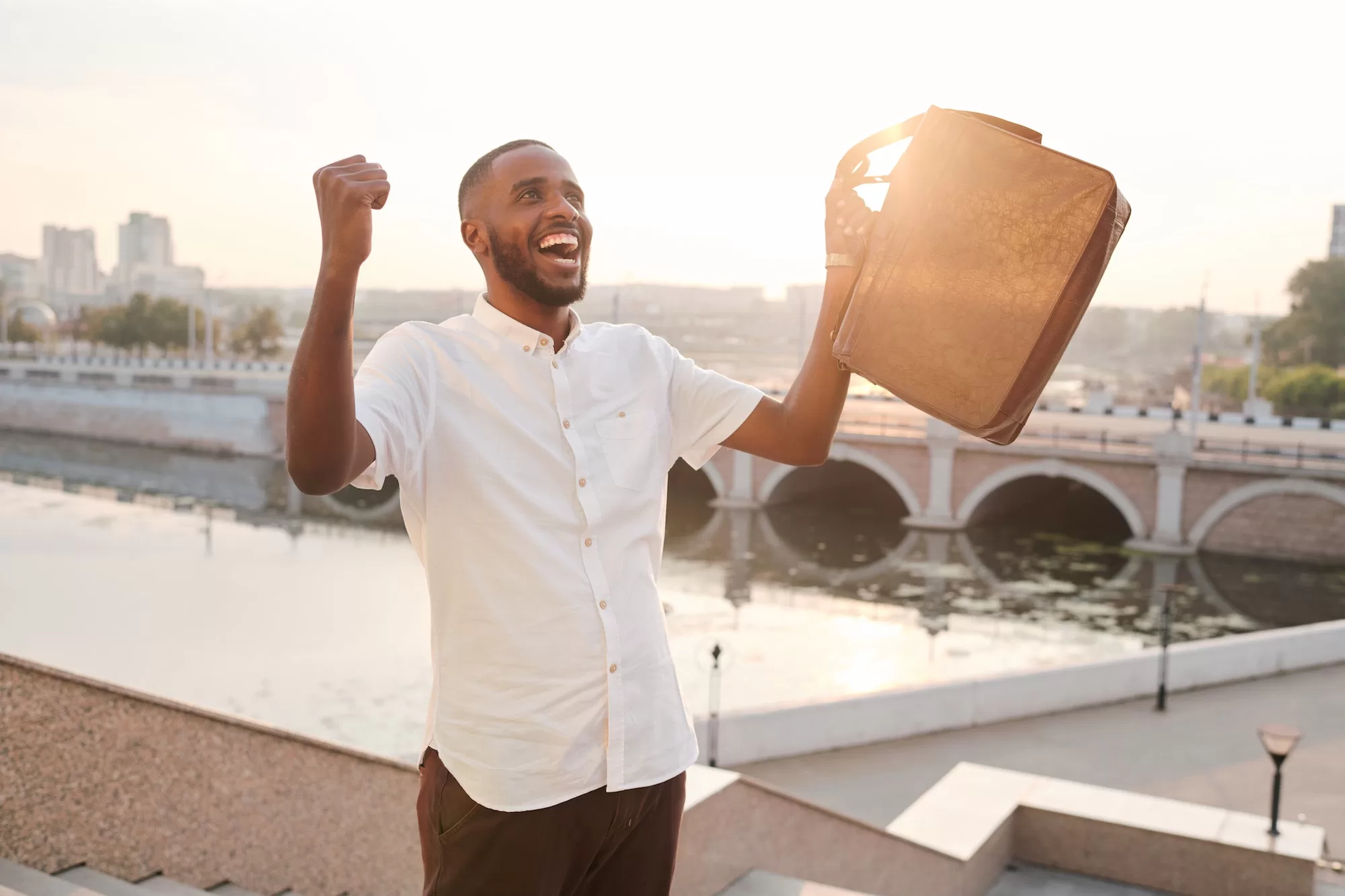 Excited African student on staircase | How to Apply for The KPMG Bursary in Namibia