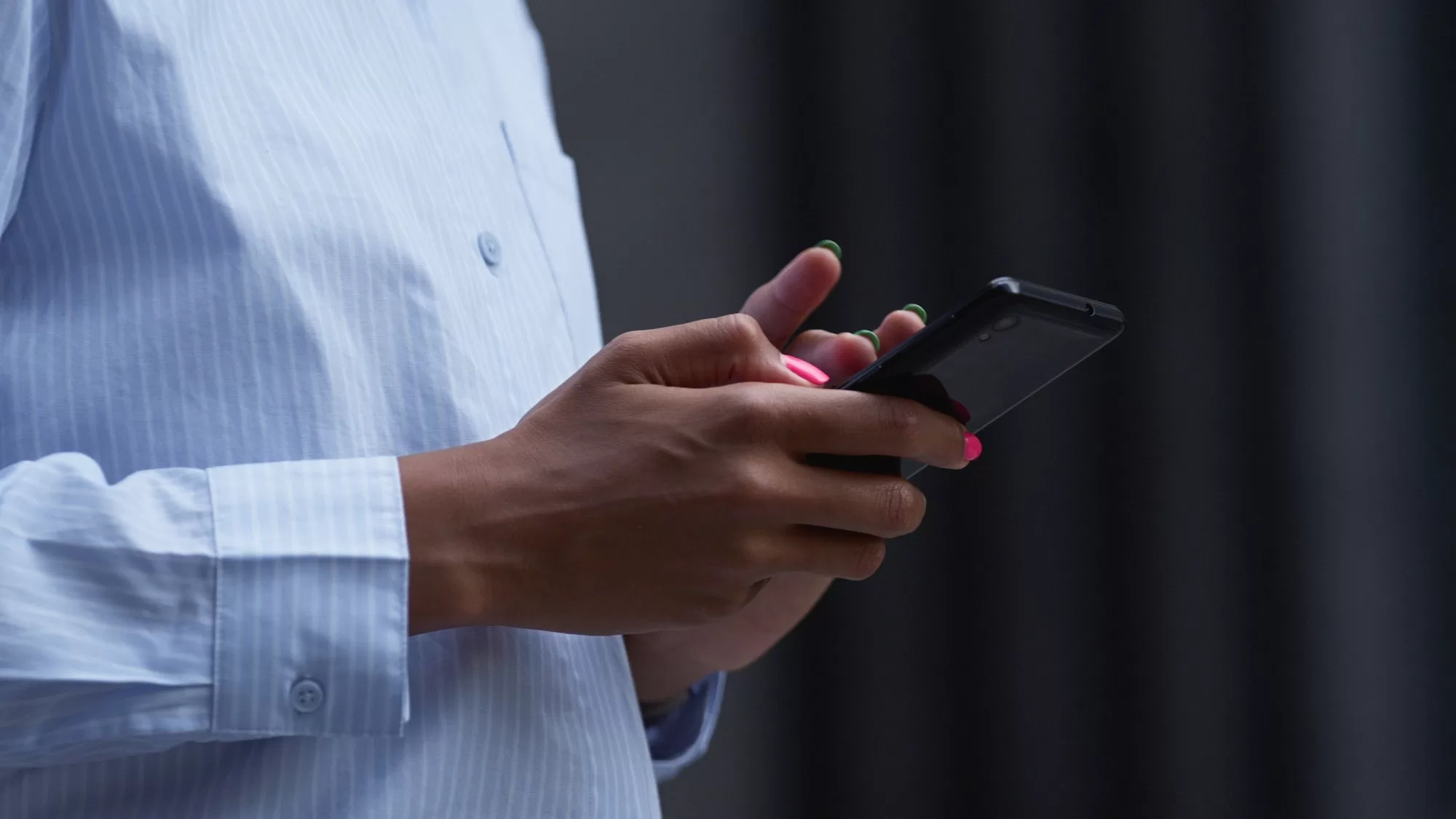 Female hand holding phone swiping closeup. Application Process and Mandatory Documents to become the Team Supervisor for the Namibian Census 2023