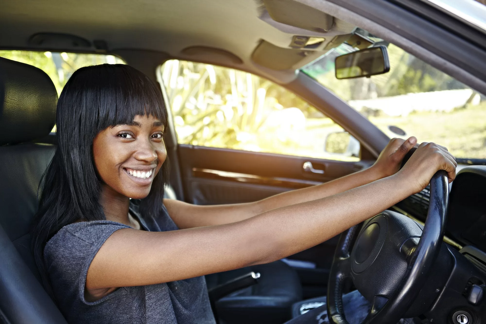 Portrait of young woman driving car | 5 common NaTIS learner drivers mistakes that are costing you time and money!