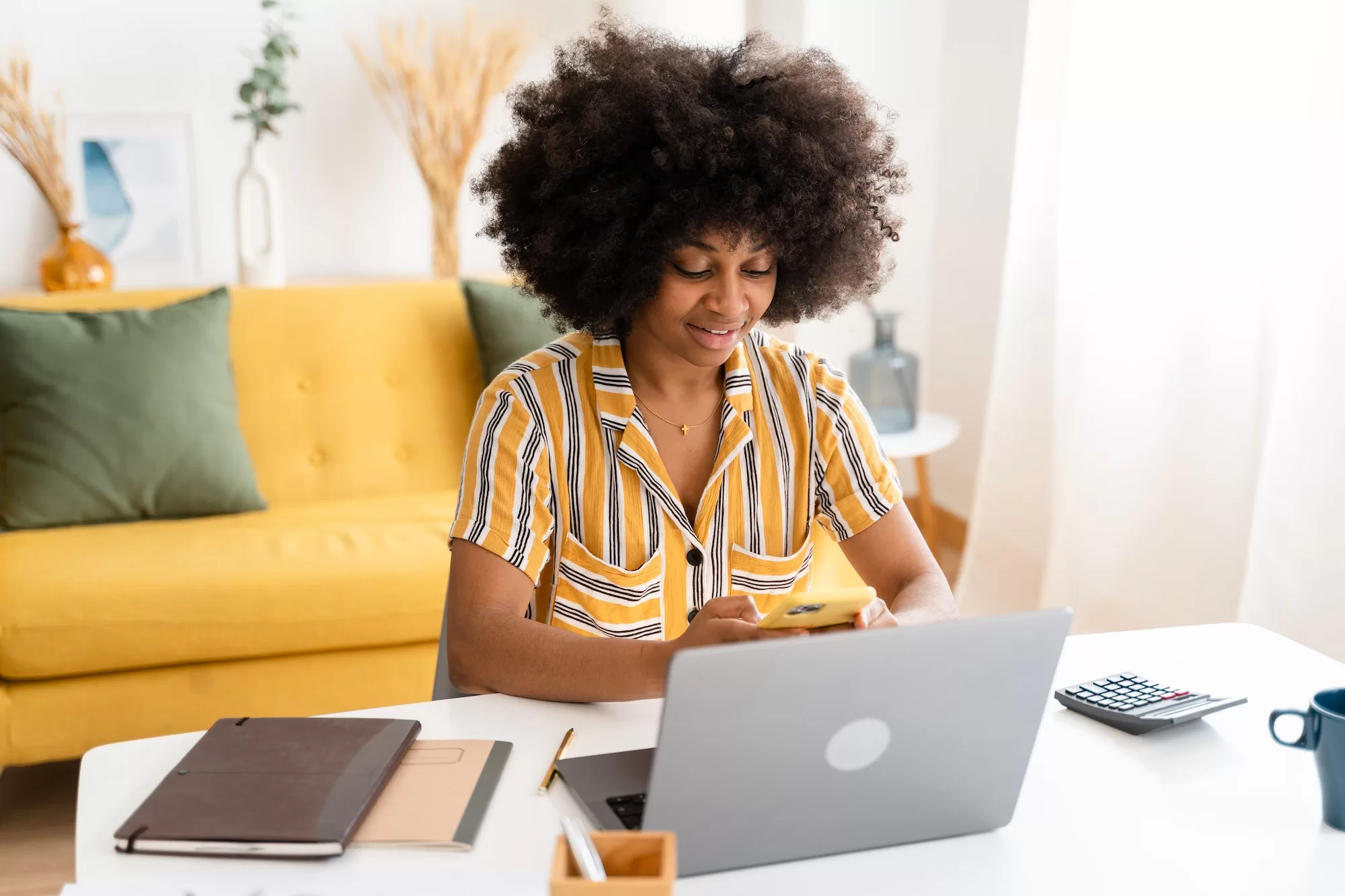 Smiling black woman using laptop to complete the 2023 Census Declaration Form For NSA vacancies 2023