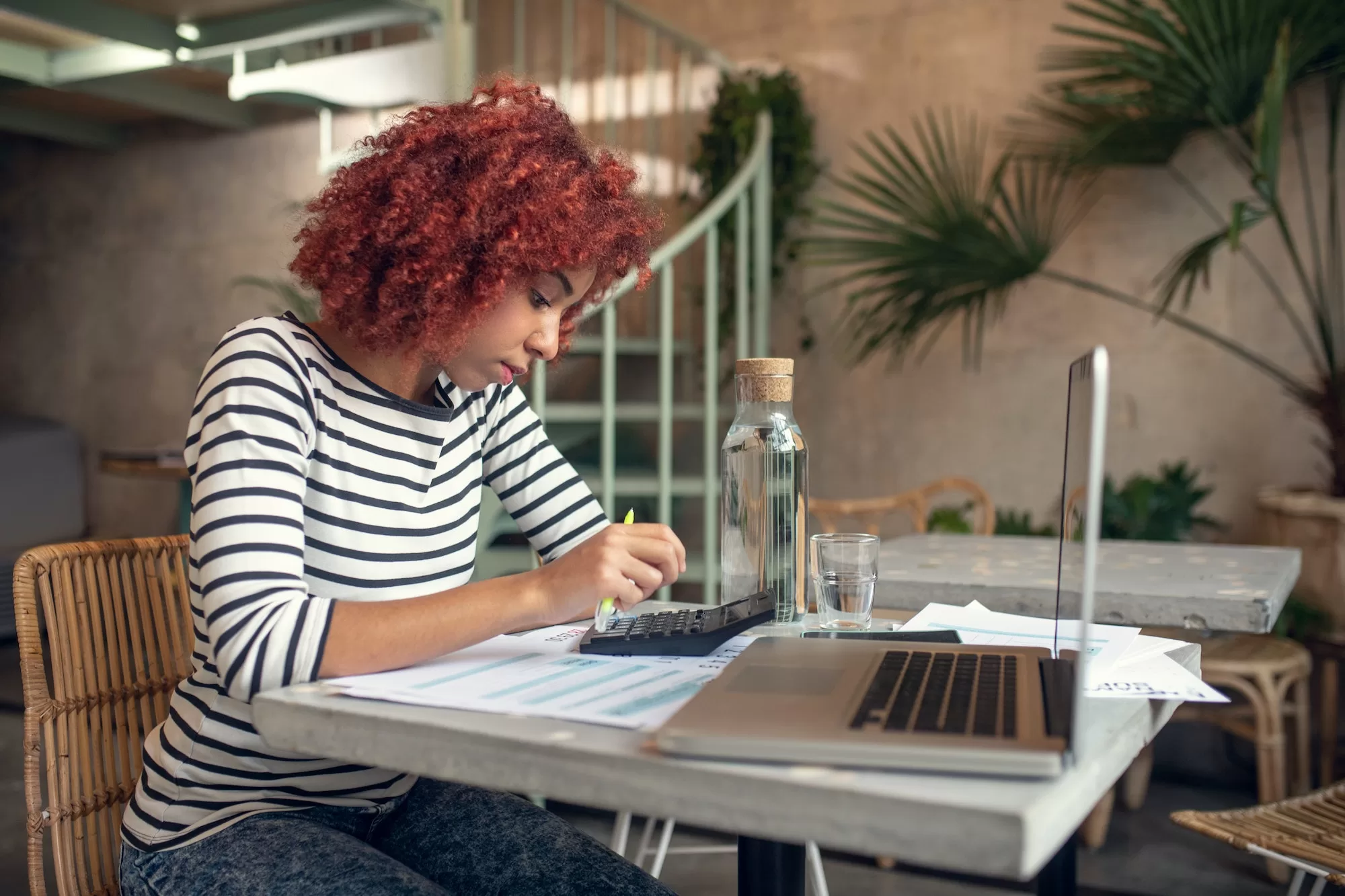 Woman calculating money while filling tax declaration | SARS e-Filing