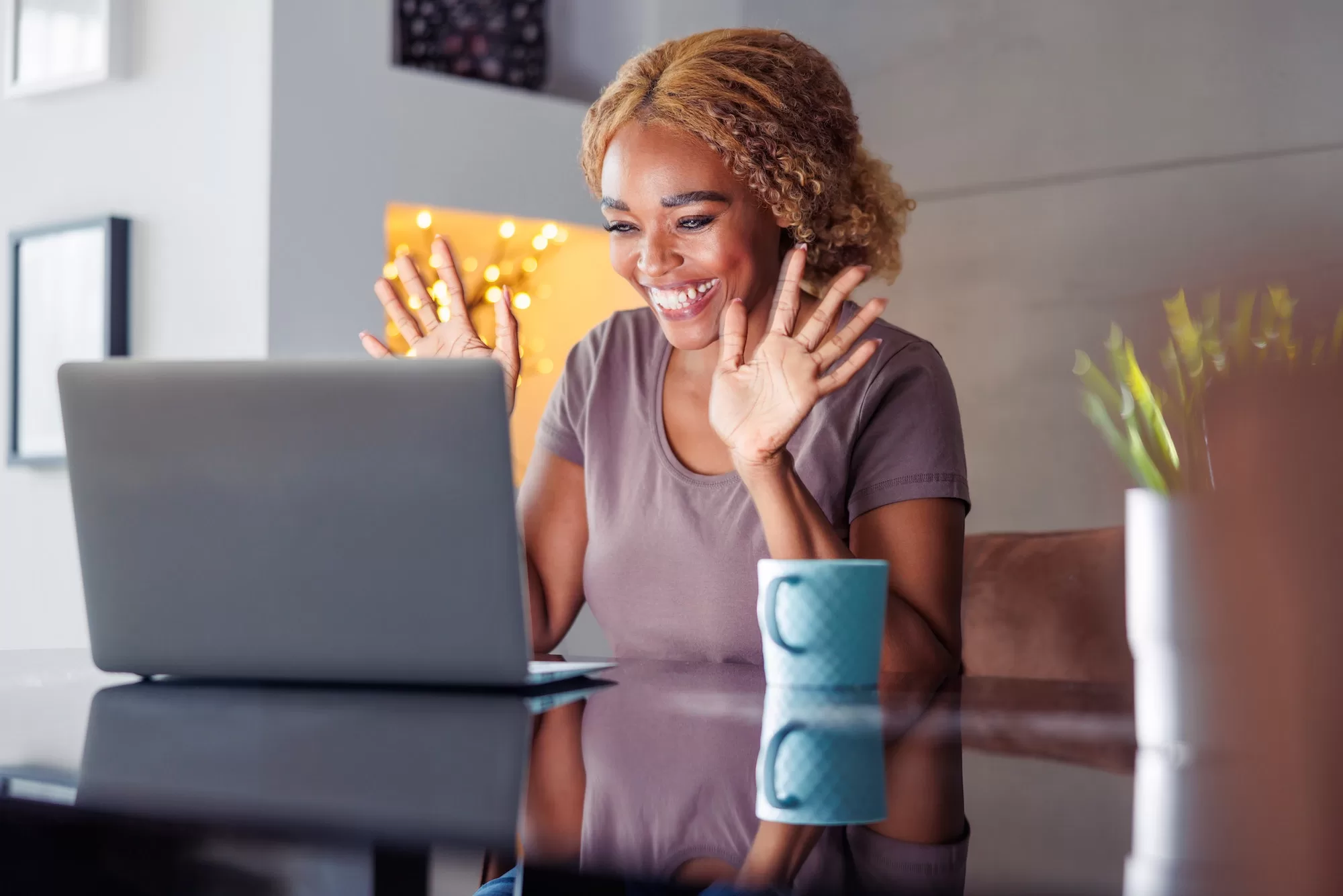 Woman relaxing at home having video call using laptop computer | Type of New Services ,DEL, ISDN and Flexifixed Service Required