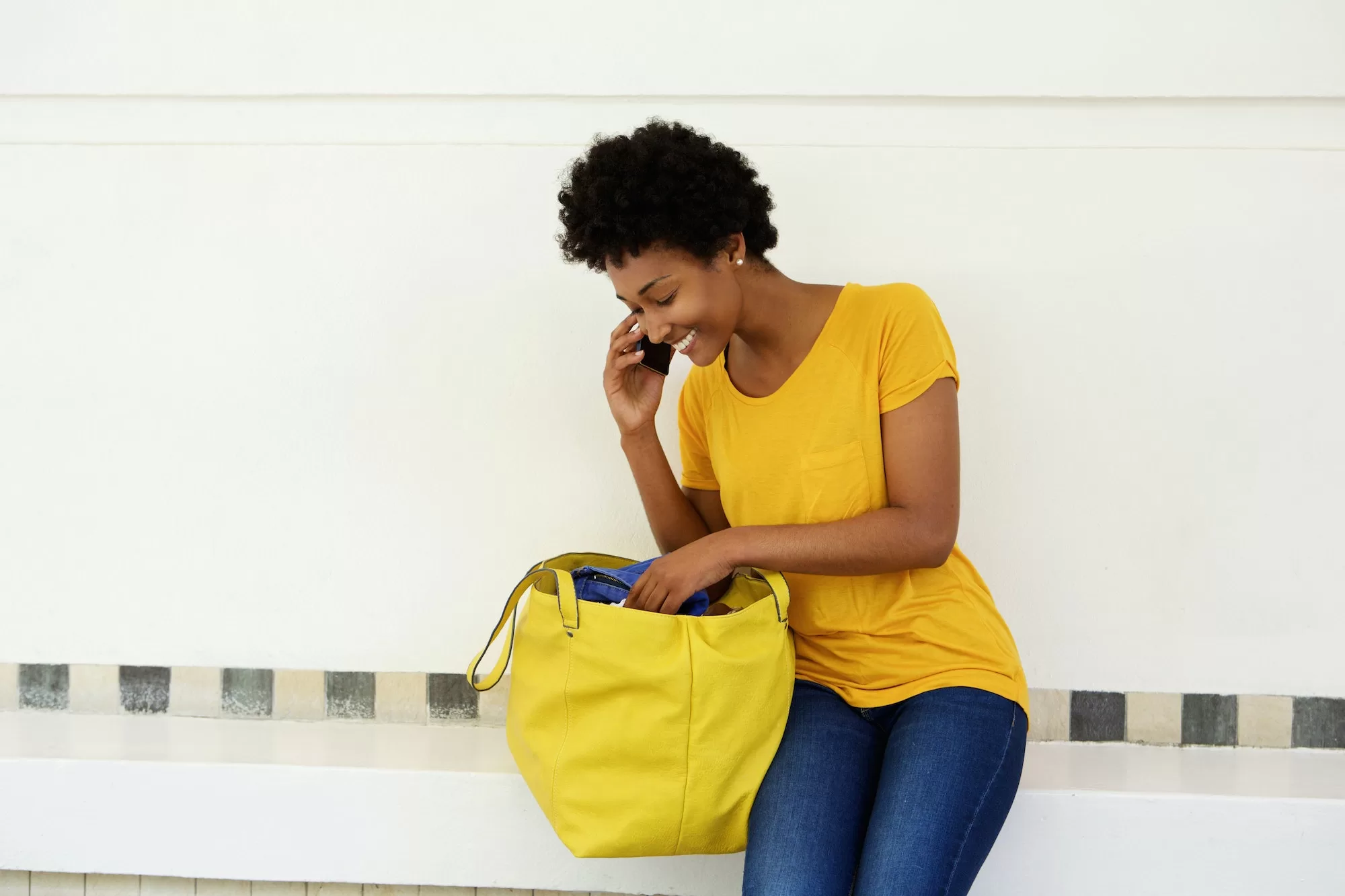 Young African woman making a phone call | How do I apply for TN Mobile Caller ID?