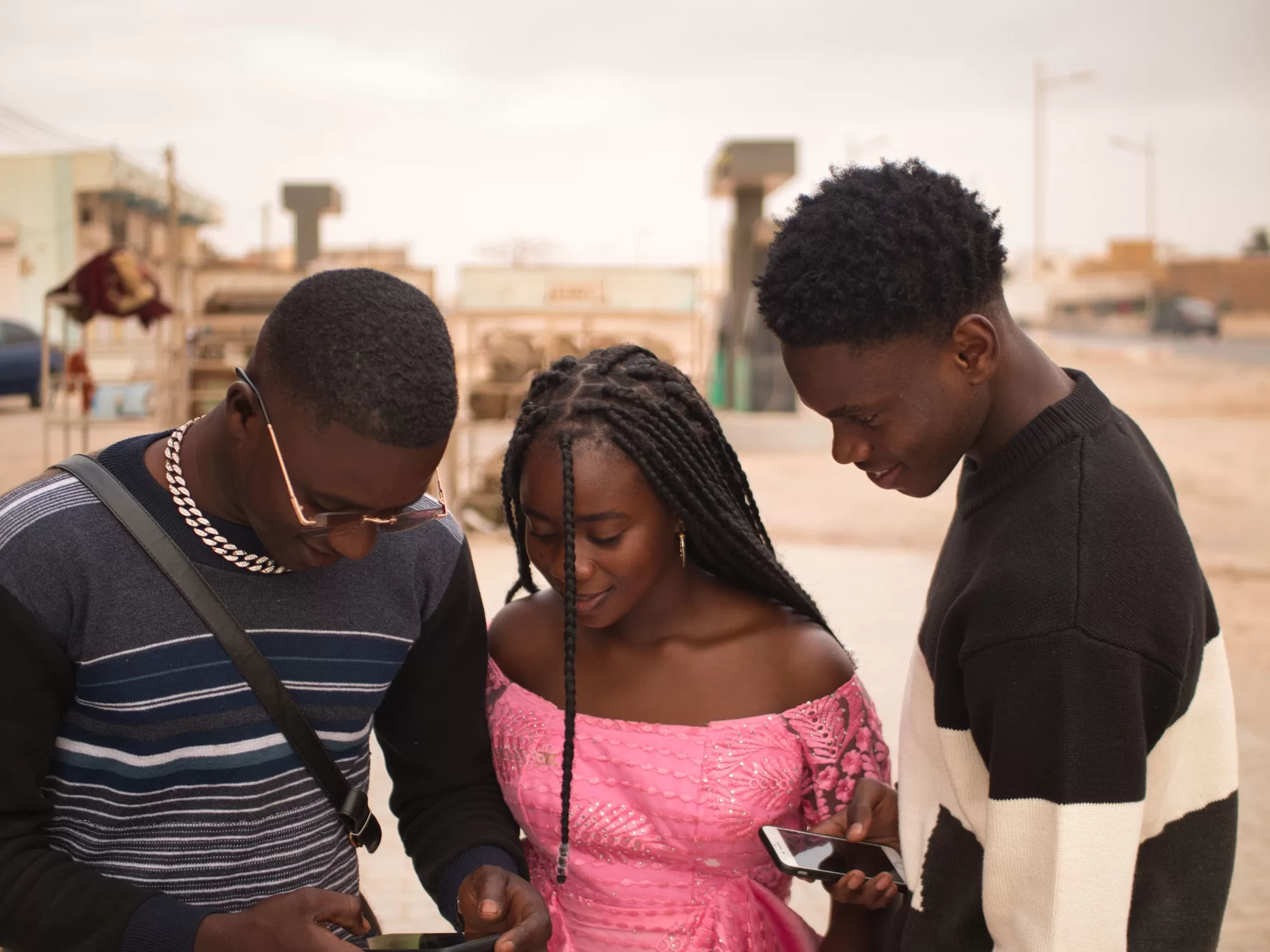 Surfing the Tides of Connectivity With Jiva Surf. African friends using a smartphone