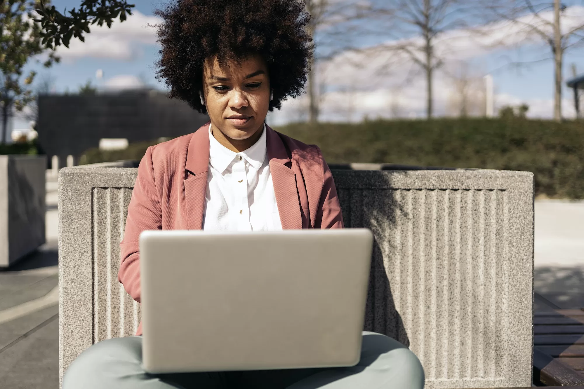 Afro Woman Using Laptop - Guide to Signing Up on the ITAS Web Portal | Your Easy Step by Step Guide