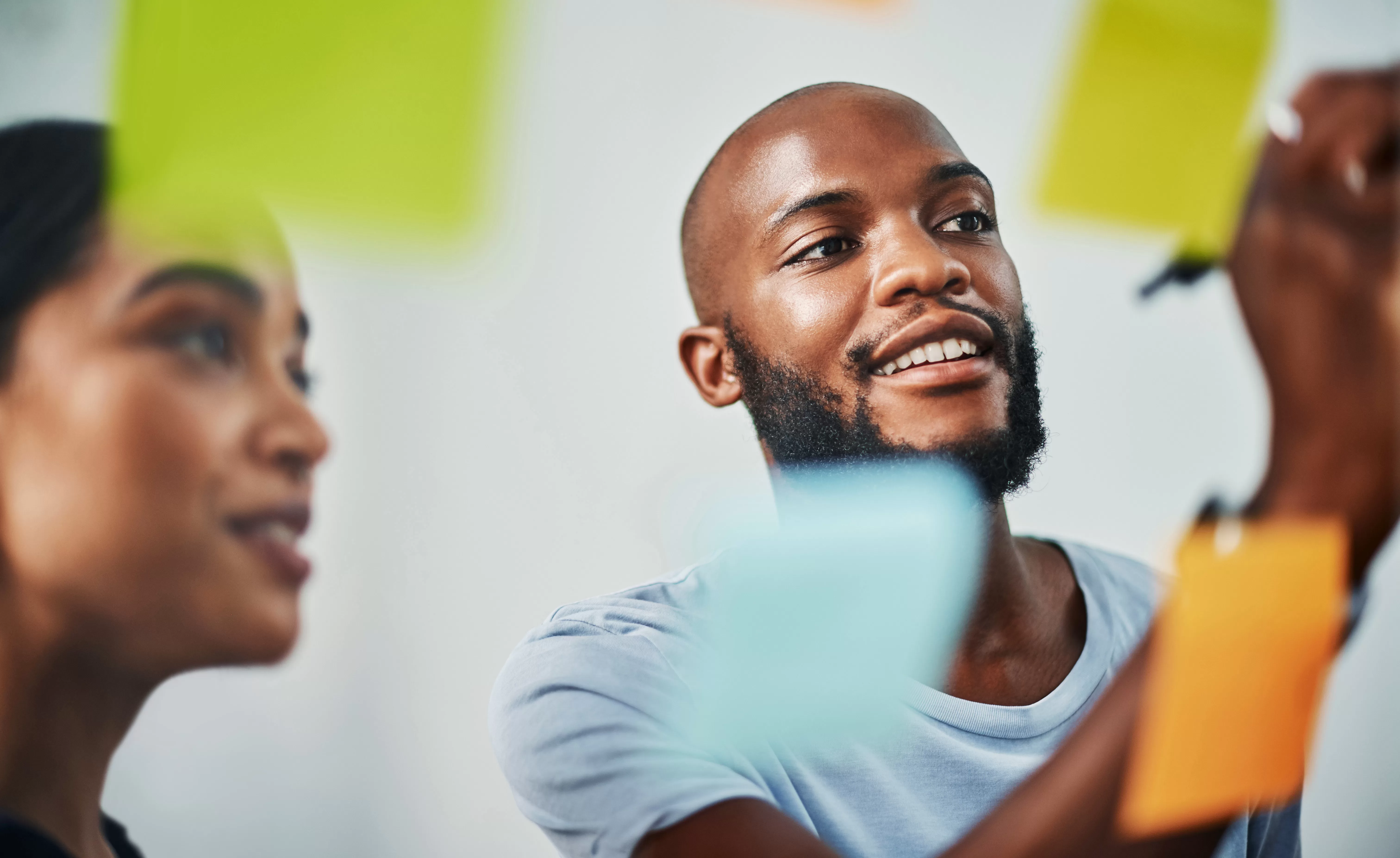 Cropped shot of two young business colleagues brainstorming on a glass wipe board in their office. Namibia Institution Leading to Entrepreneurs (NILE) Contact Information