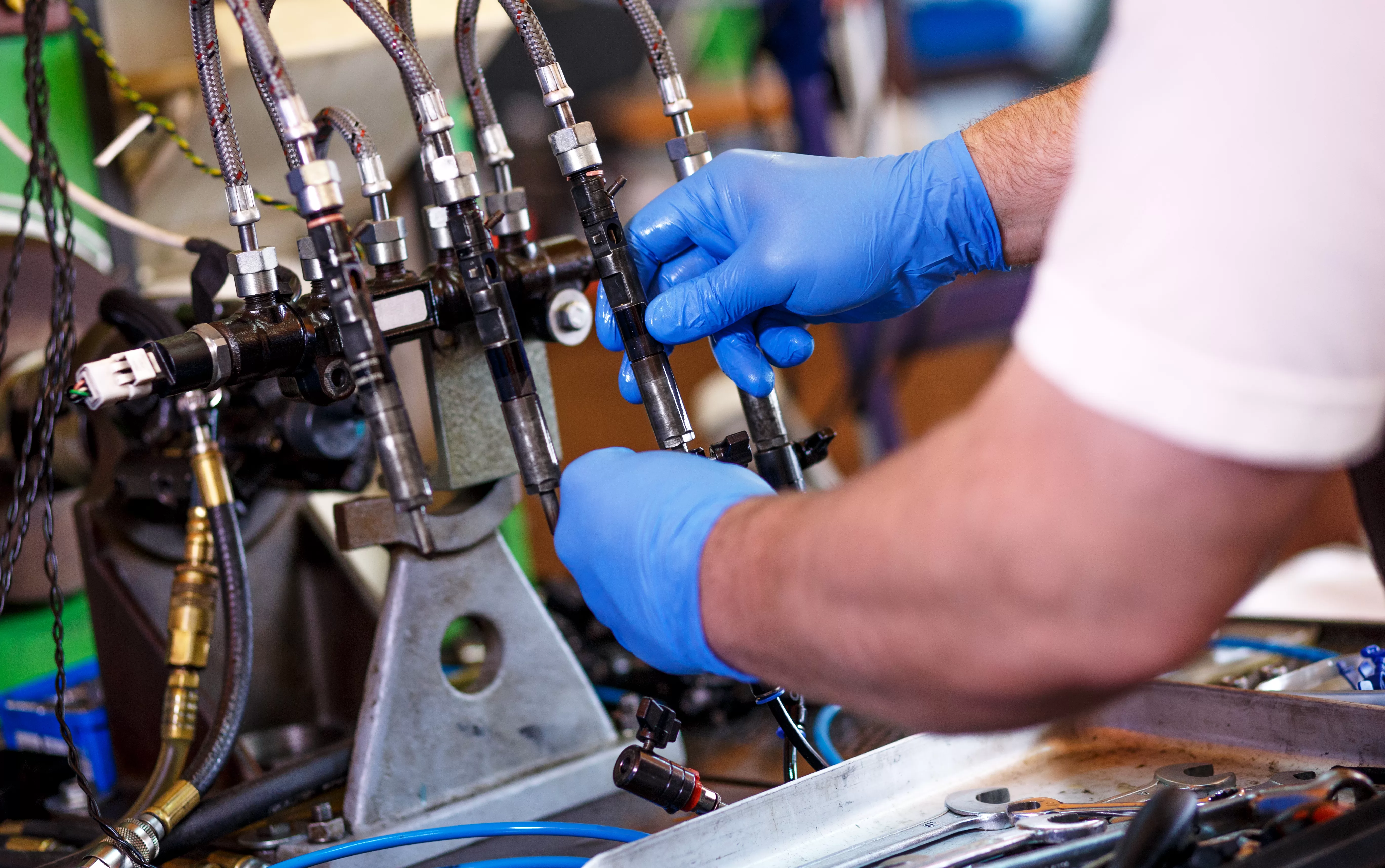 NamWater Human Resource Development Centre (HRDC): Professional mechanic testing diesel injector in his workshop.