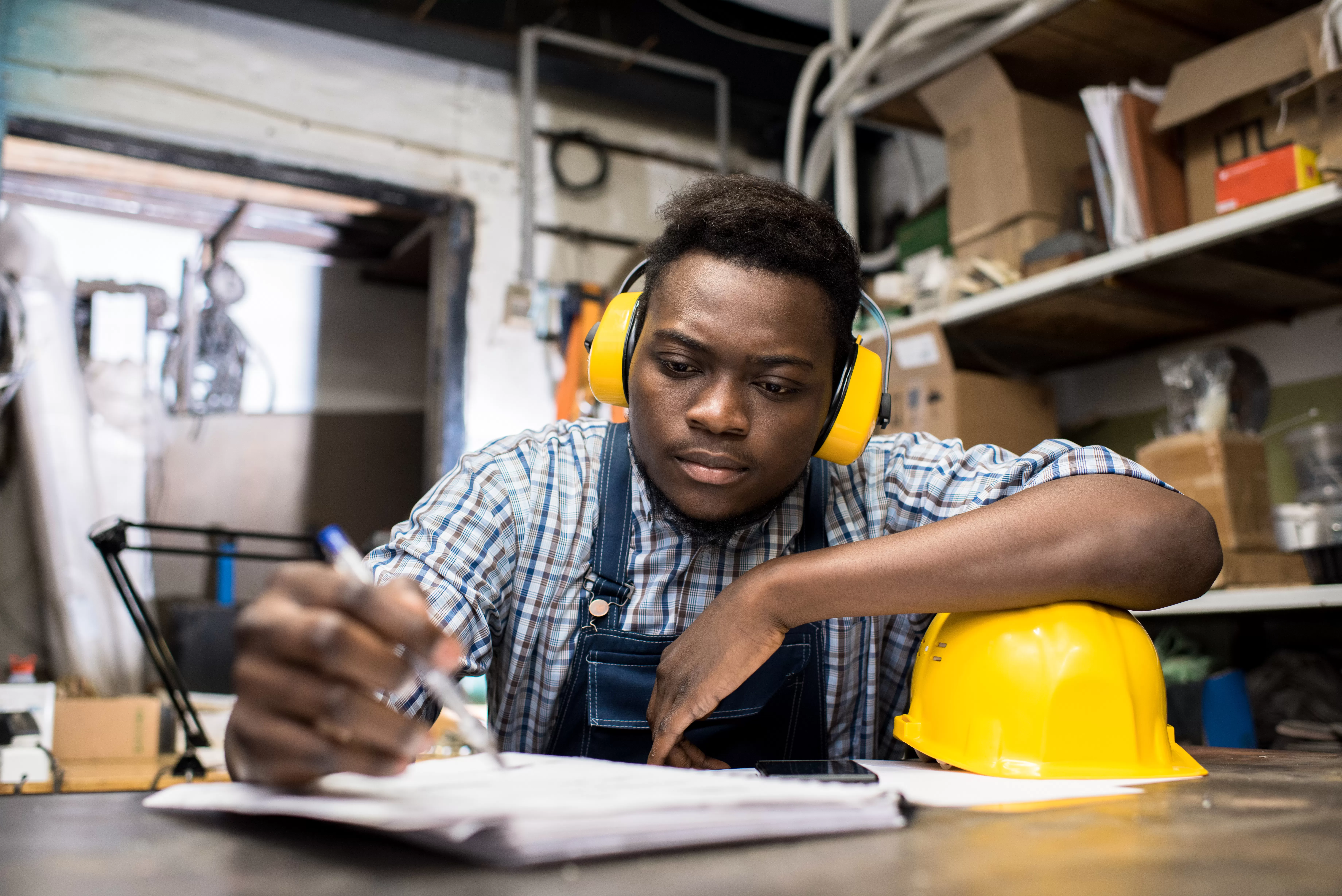Thoughtful young engineer working in dark room. Namibian Institute of Mining and Technology (NIMT) Keetmanshoop Campus