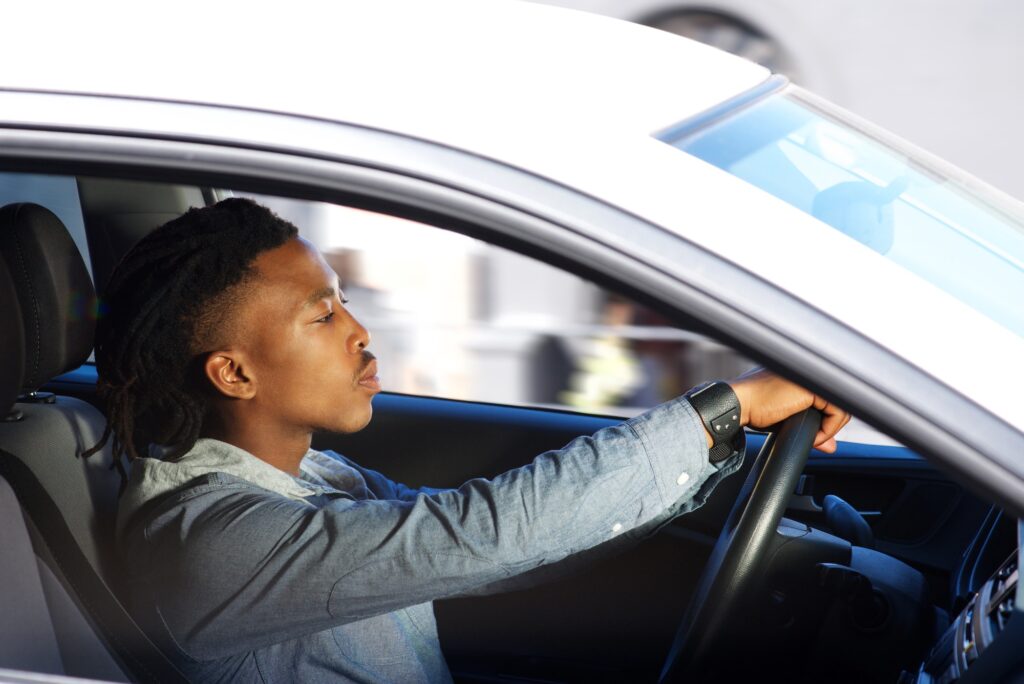 Young black man driving car | Join Our K53 Community - Supportive and Free!